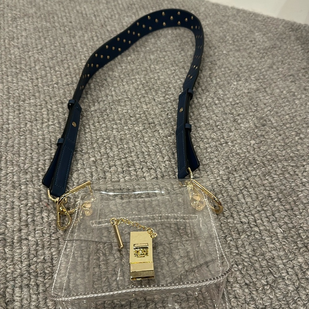 Clear bag with removable strap.